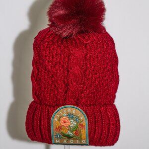 Red stocking cap with "Nature is Magic" patch and fuzzy lining